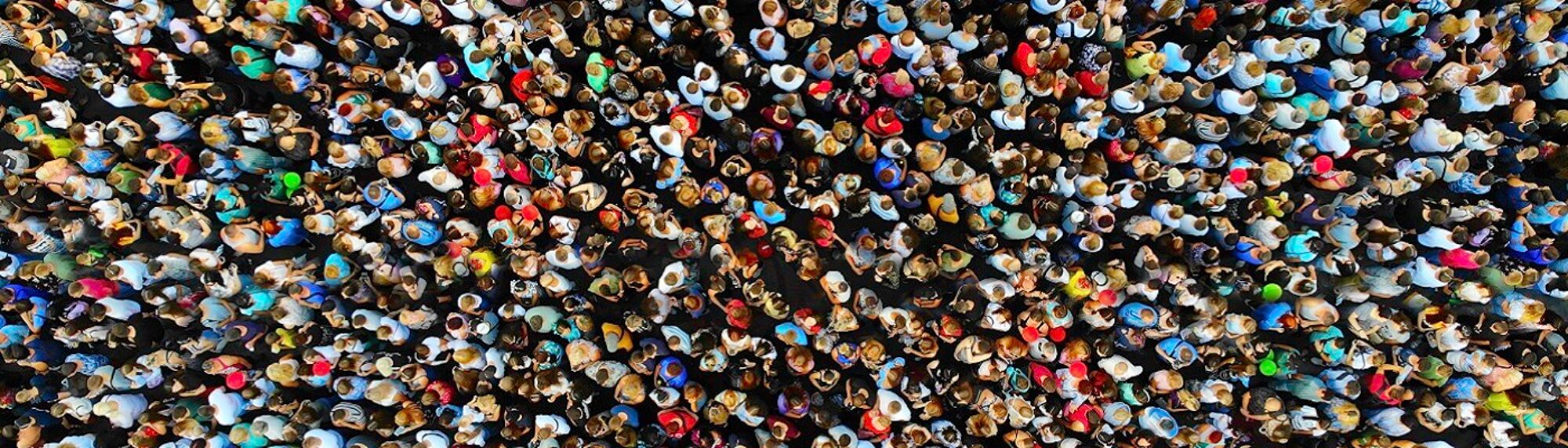 View of a crowd of people from above. Source iStockphoto | Dmytro Varavin https://www.istockphoto.com/photo/big-crowd-of-people-people-gathered-together-in-one-place-top-view-from-drone-gm1357524756-431402297