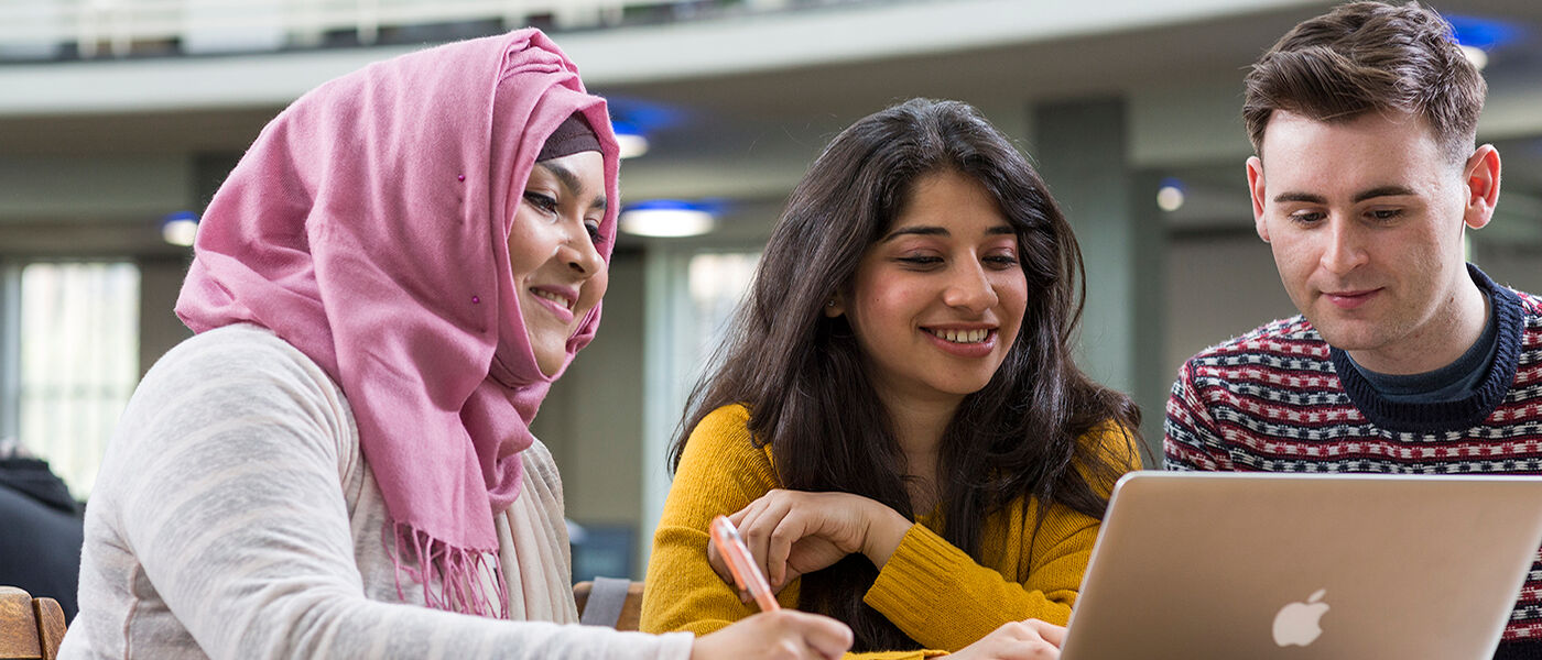 Image of students at a computer