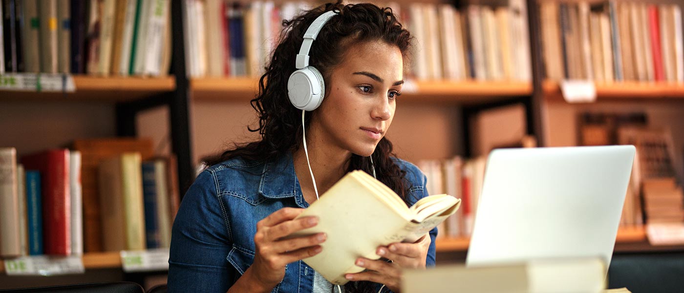 Student studying with headphones