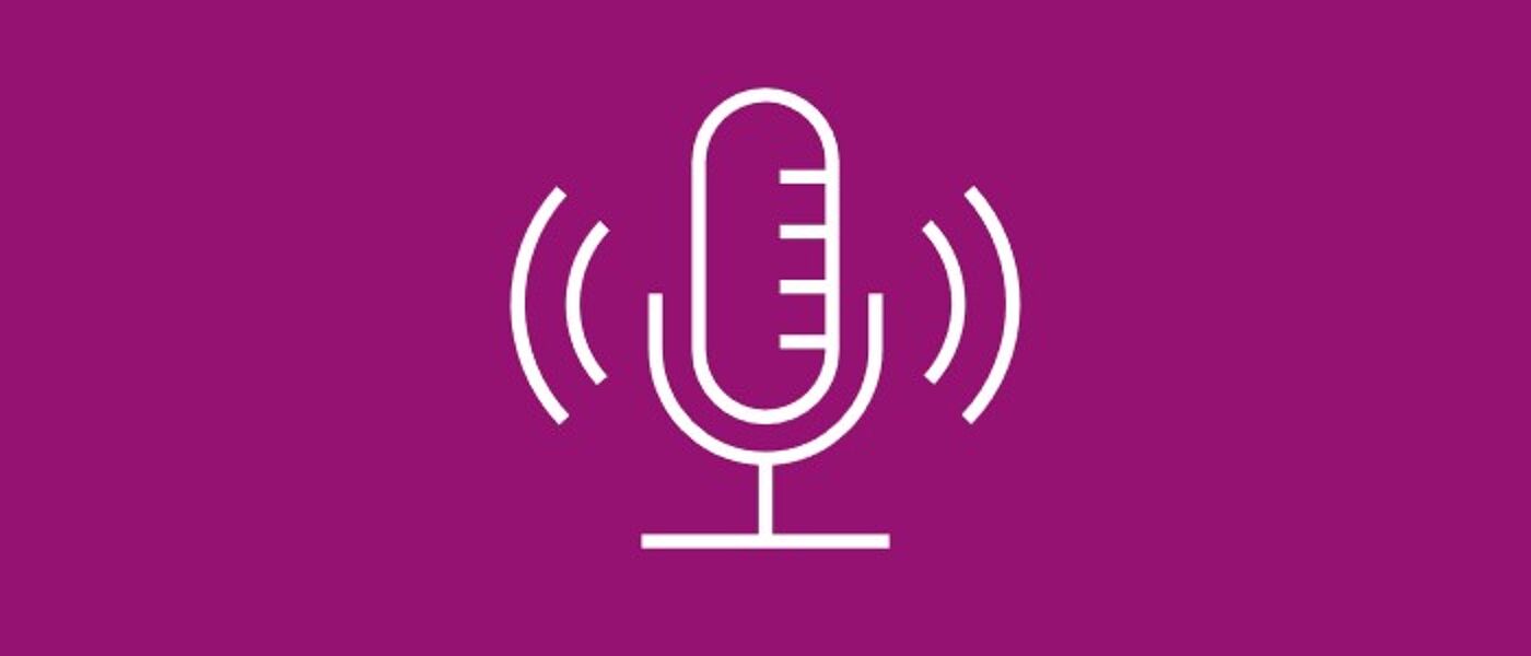 White icon on pink background depicting a microphone