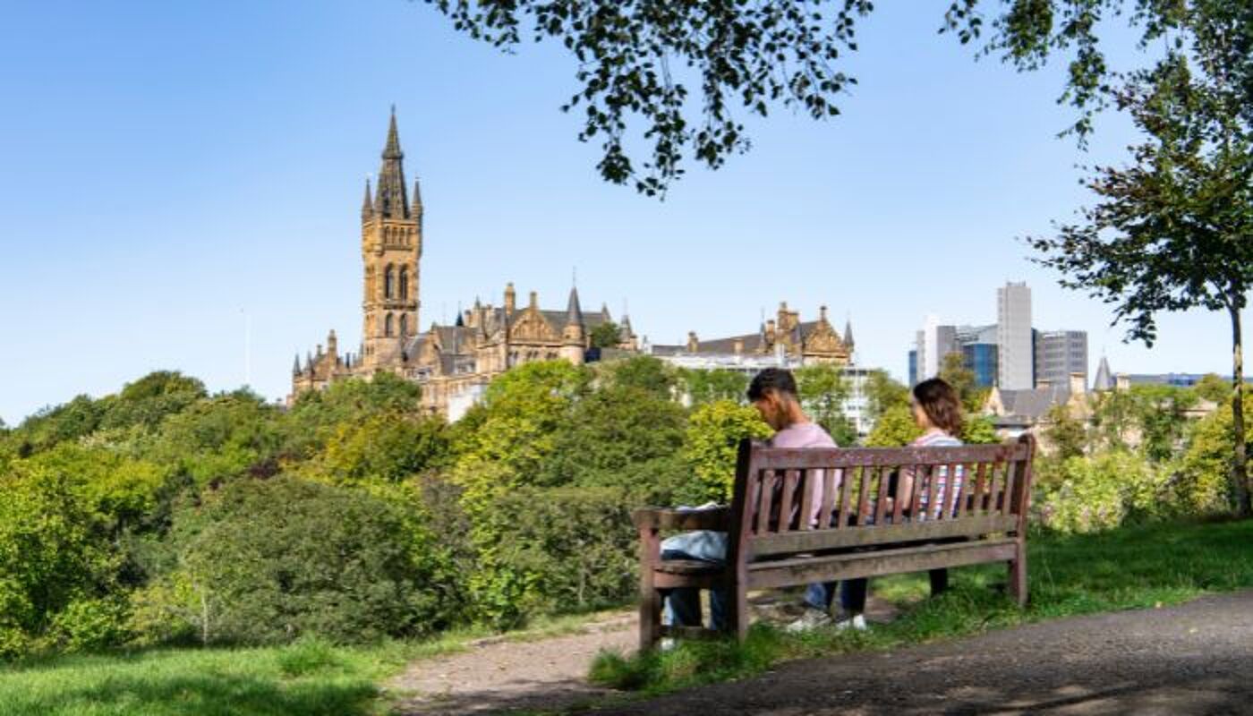 Students sitting on a bench n Kelvingrove park