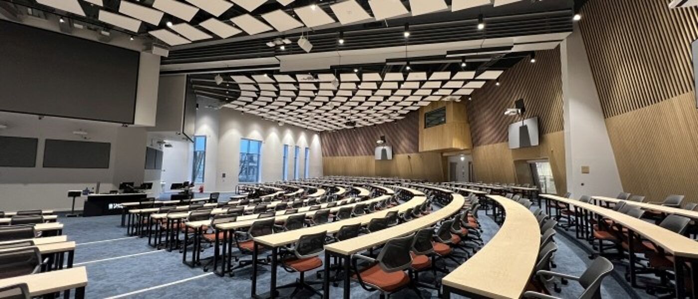 View of a lecture theatre, showing the seating and primary teaching wall.