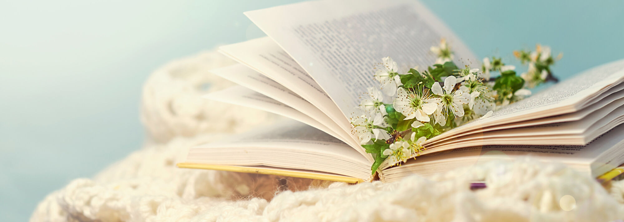  a nostalgic picture of a book with spring flowers