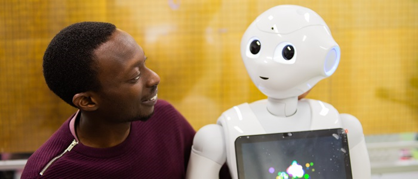 Research student with robot