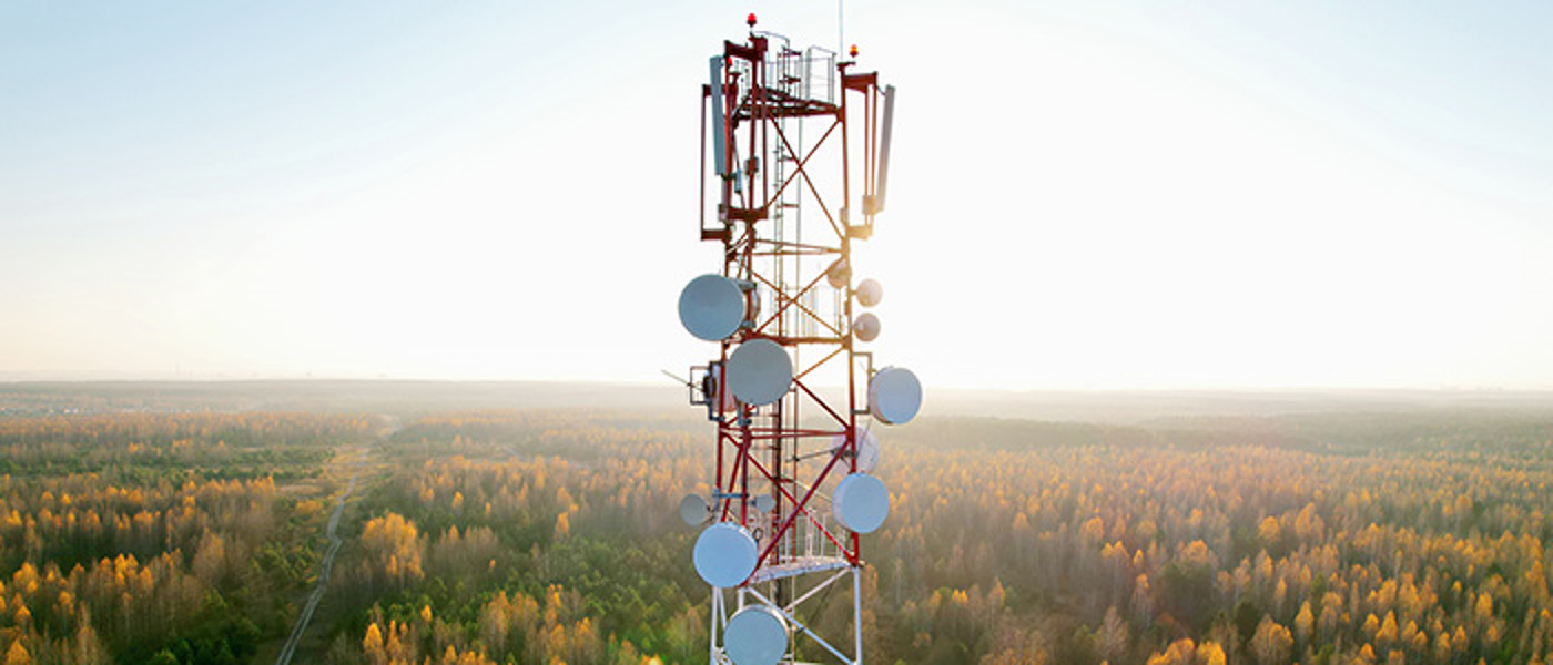 Communications tower with satellite dishes