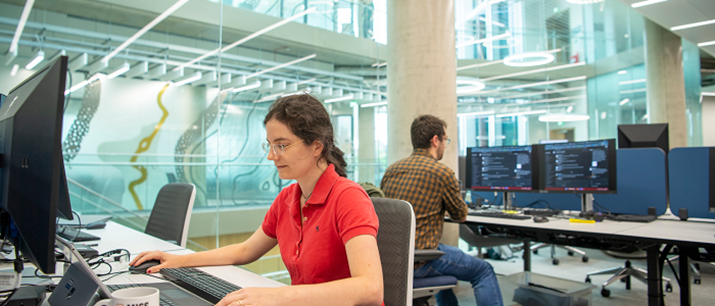 Students sitting at computers in modern building