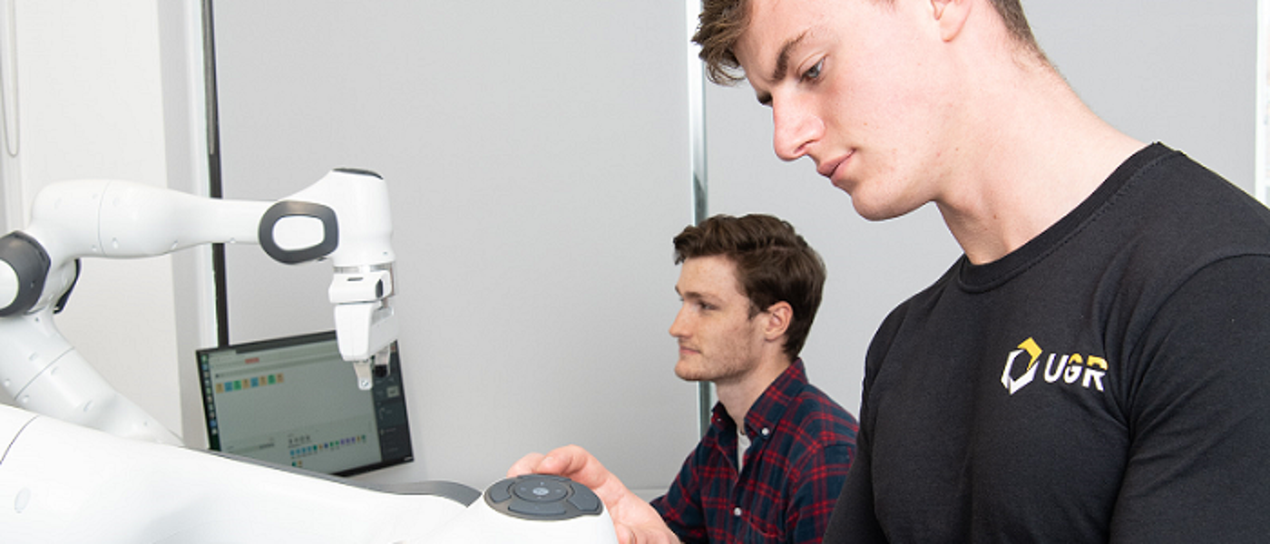 Two male students of engineering in lab