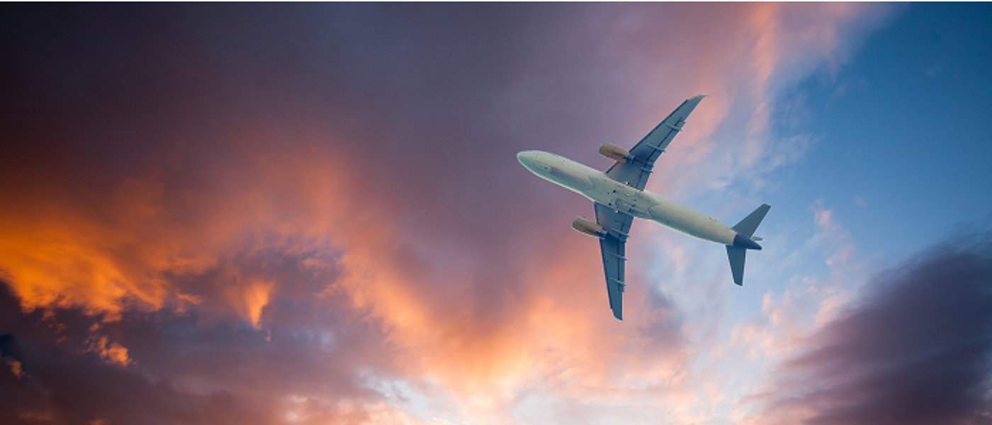 Airplane in evening sky