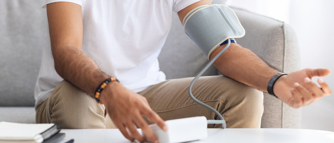 Person monitoring their blood pressure from home