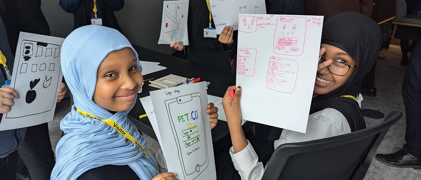 children show off school work