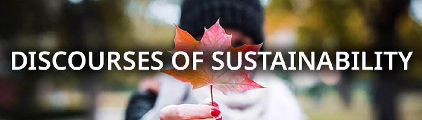 A person holding an autumnal leaf with the text Discourses of Sustainability over it