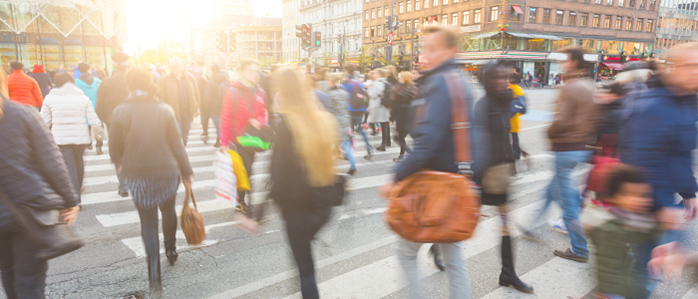 People crossing road at busy pedestrian crossing