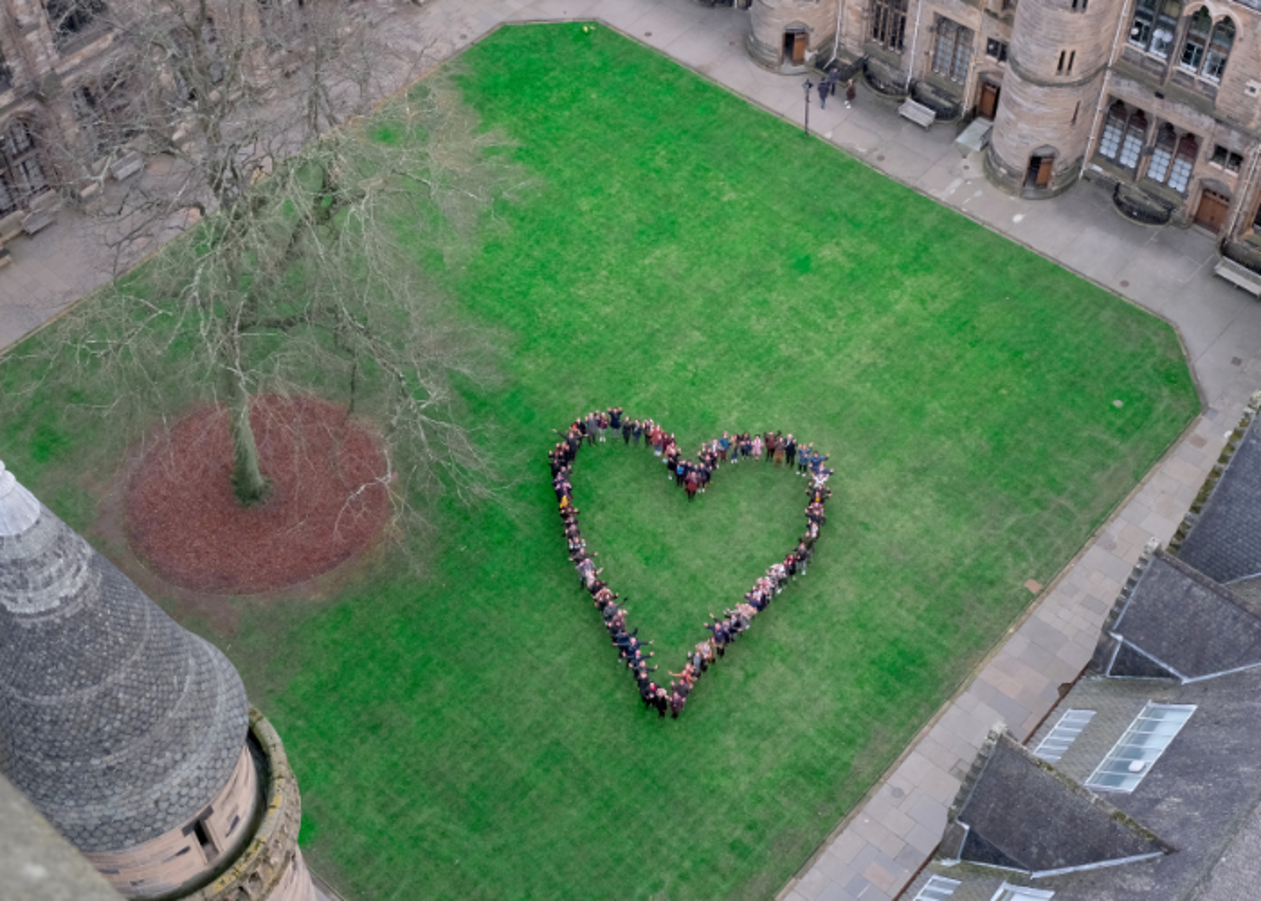 Aerial view of people forming a heart shape on the quadrangle