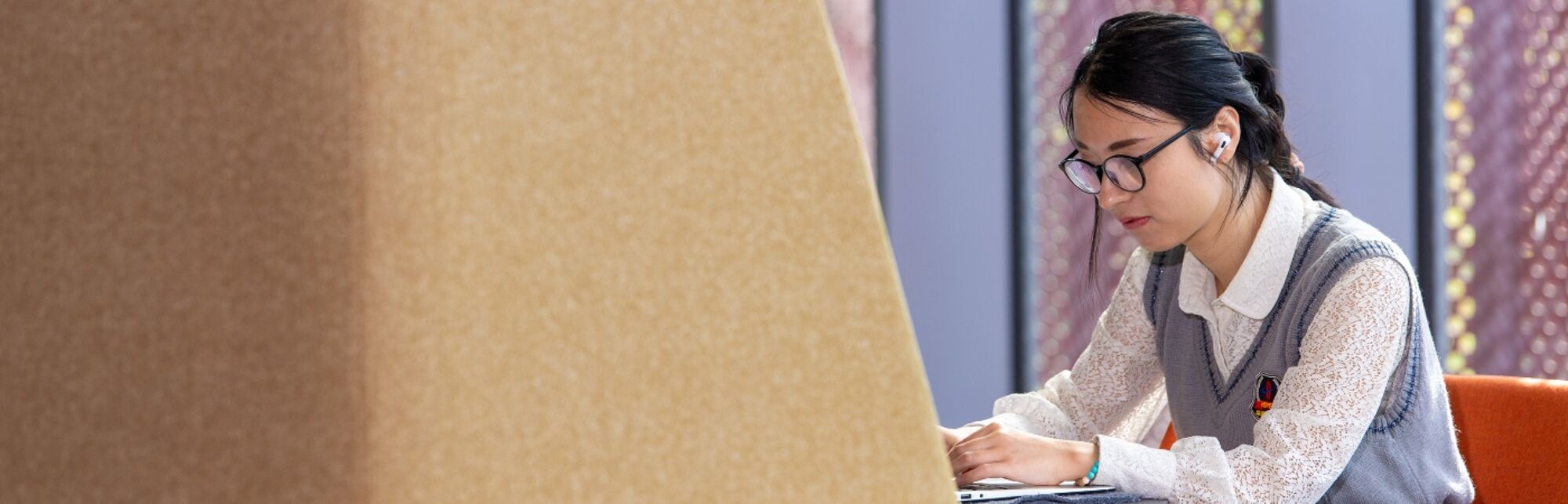 Student on a laptop in the James McCune Smith Learning Hub