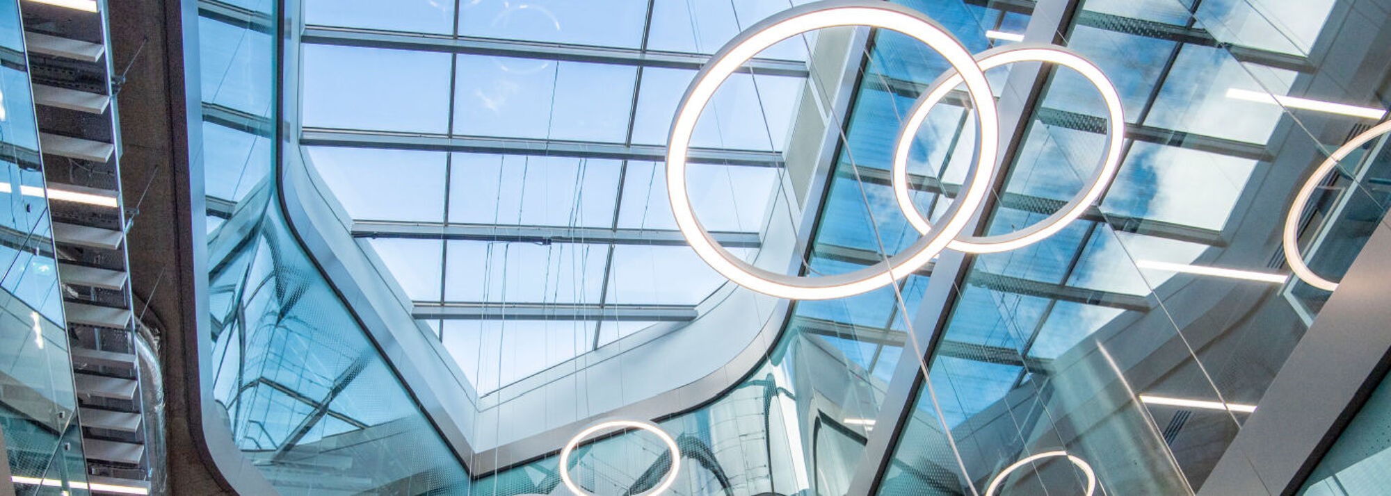 A photograph of the circular lights in the Advanced Research Centre, looking up through the sky lights.