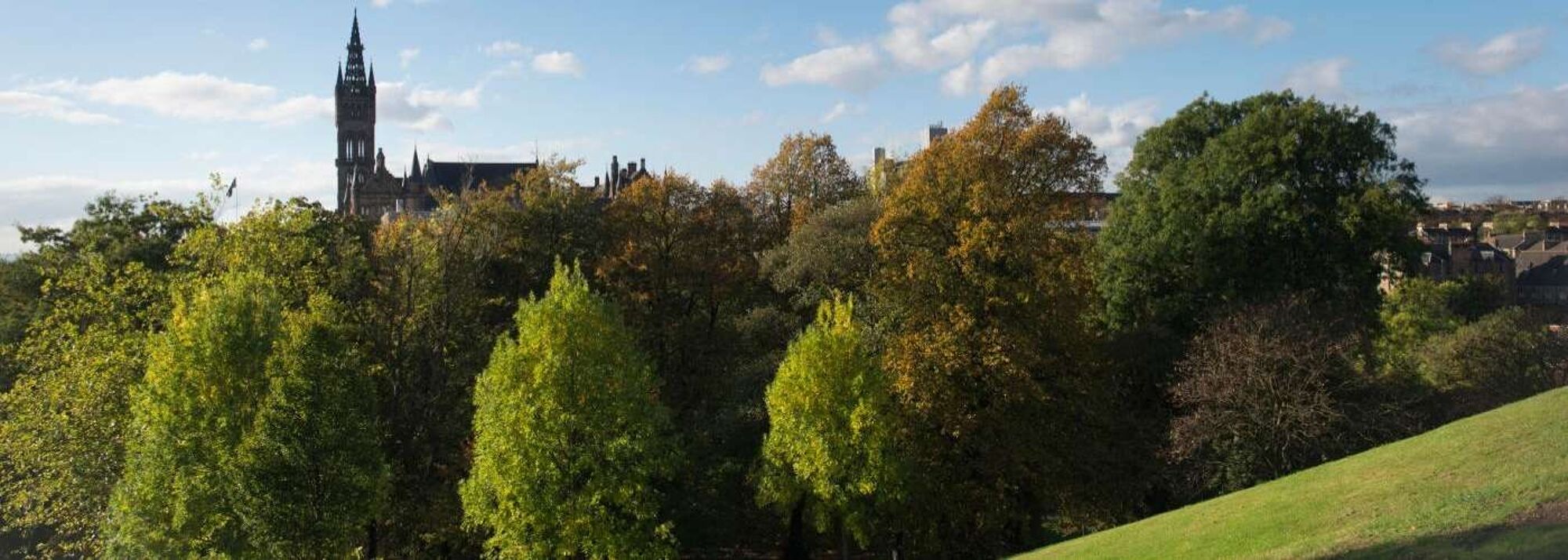 University of Glasgow tower surrounded by green trees