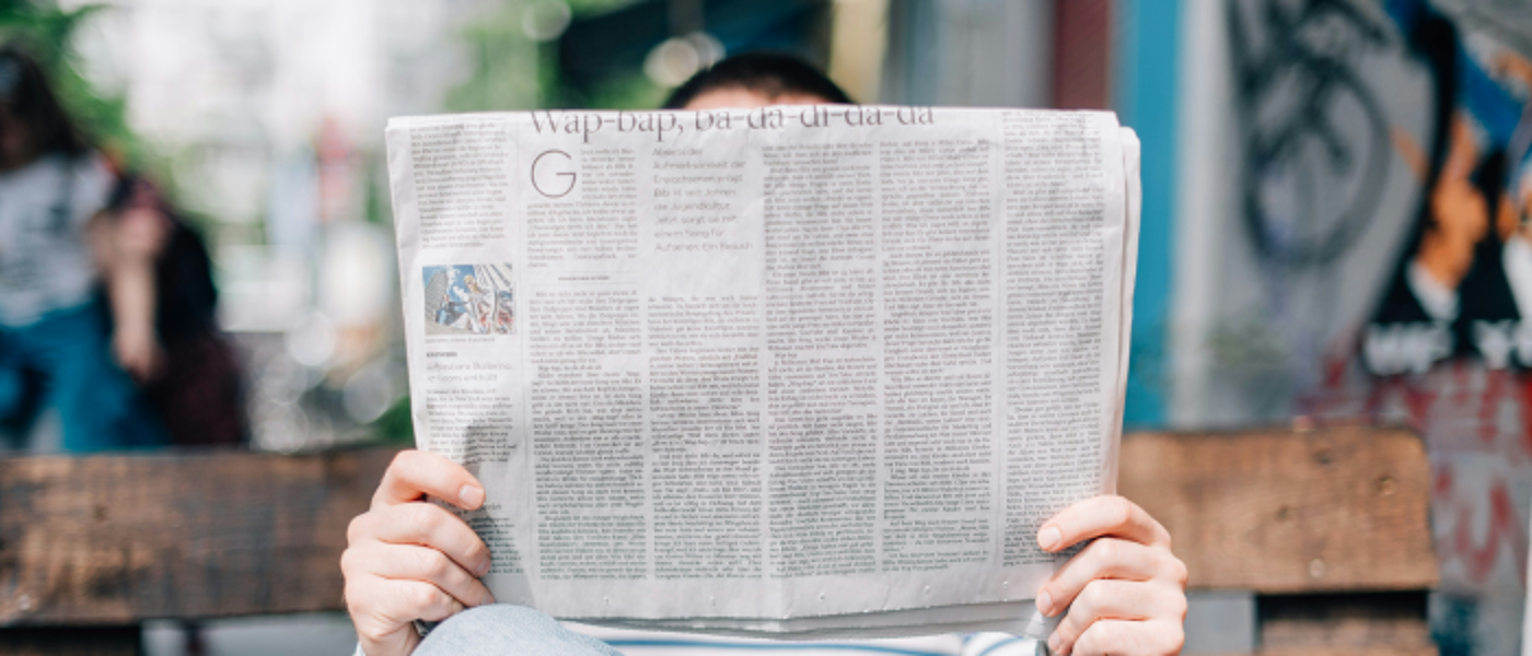 Person reading a newspaper