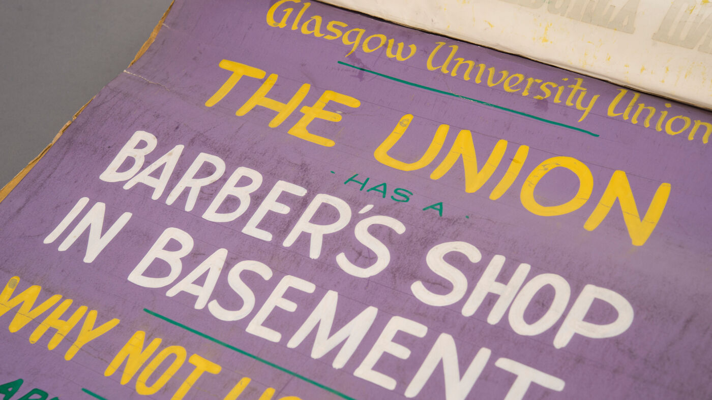A scan of a flyer for the union informing of a barber shop