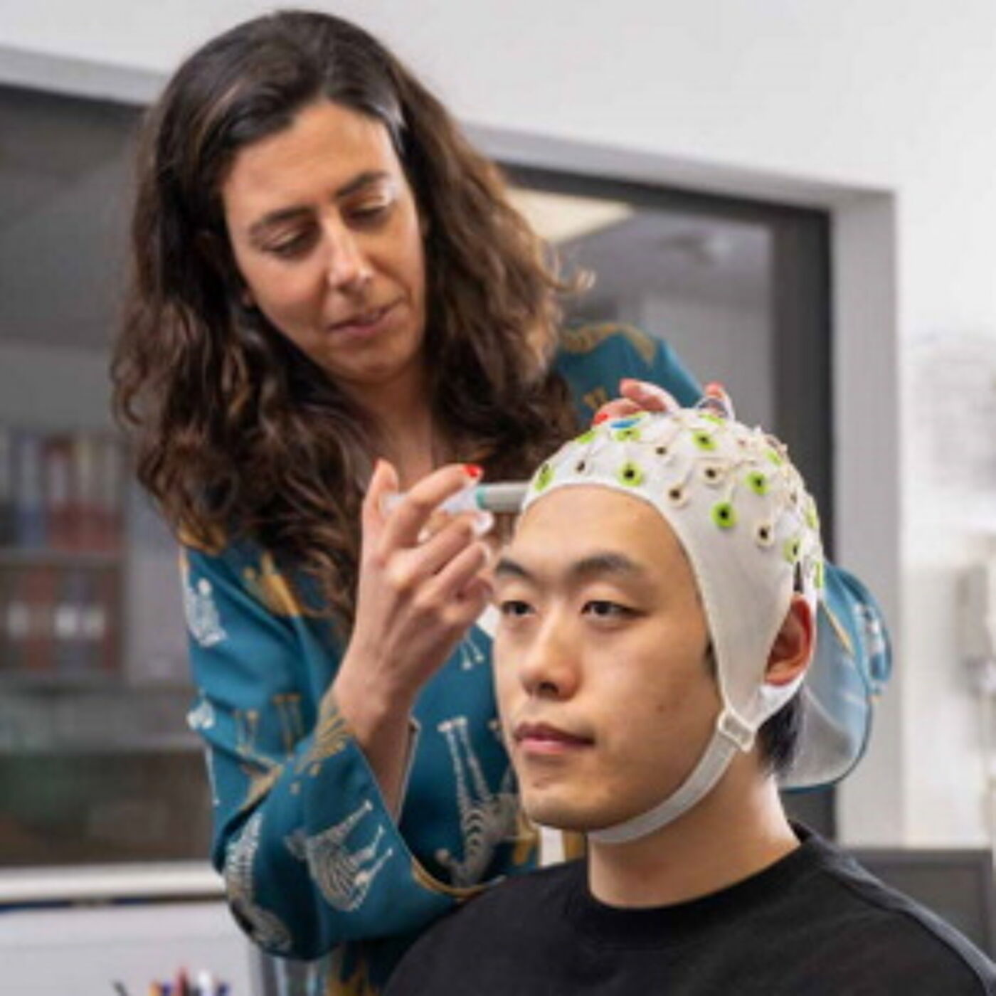 A participant being prepped for EEG