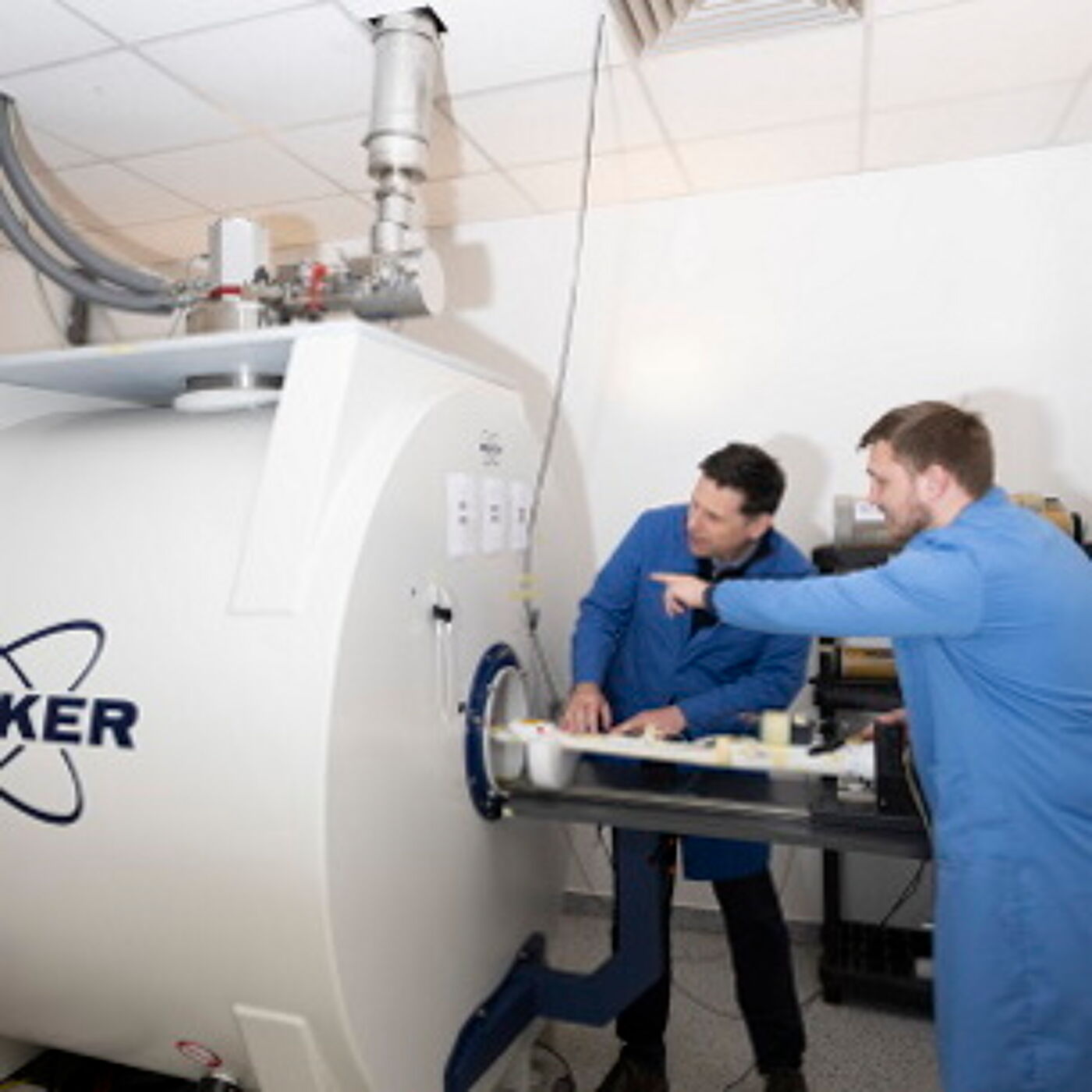 Two scientists preparing an animal scanning experiment