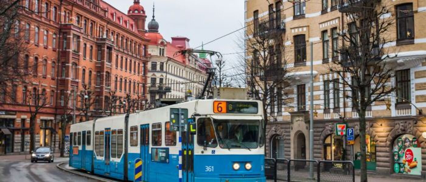 A street in Gothenburg with a tram in the foreground and buildings in the background