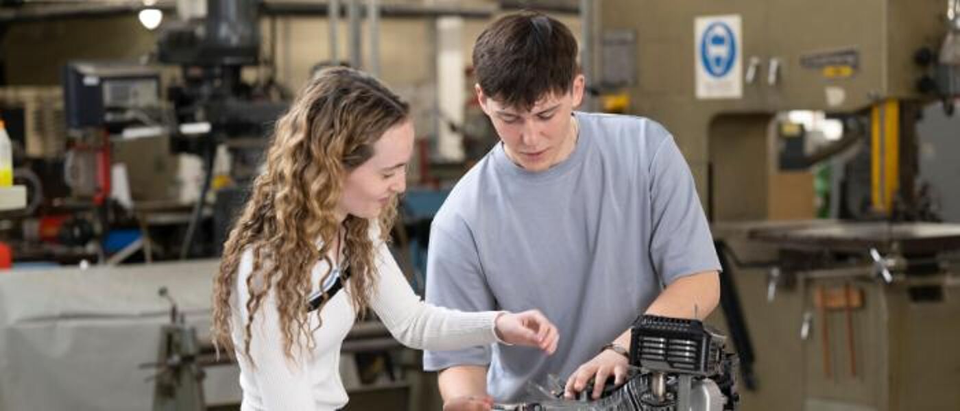 Two Mechanical Engineering students working together in a laboratory