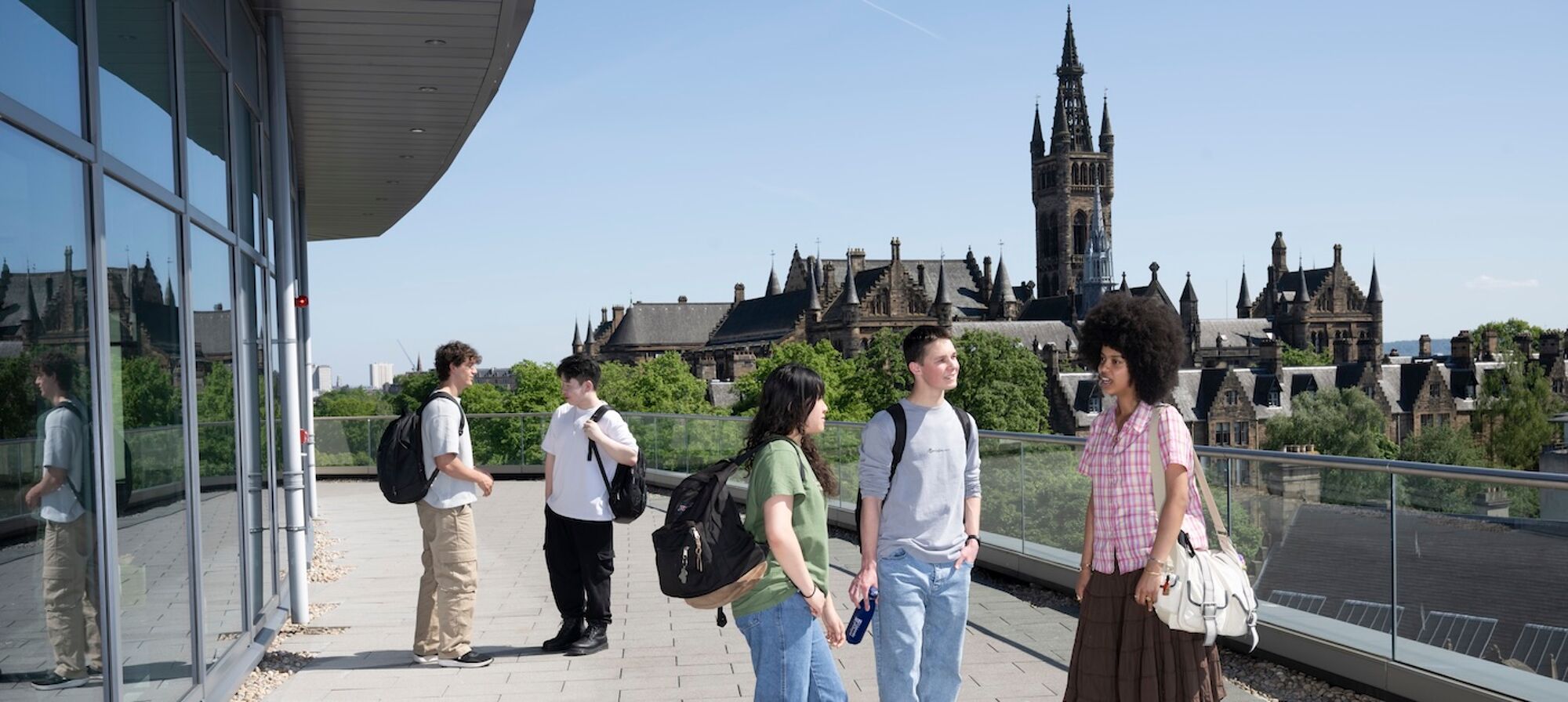 Students standing on the deck of the learning hub