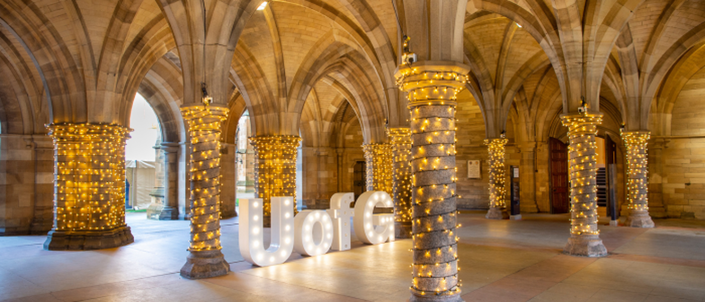 cloisters with light and UofG sign