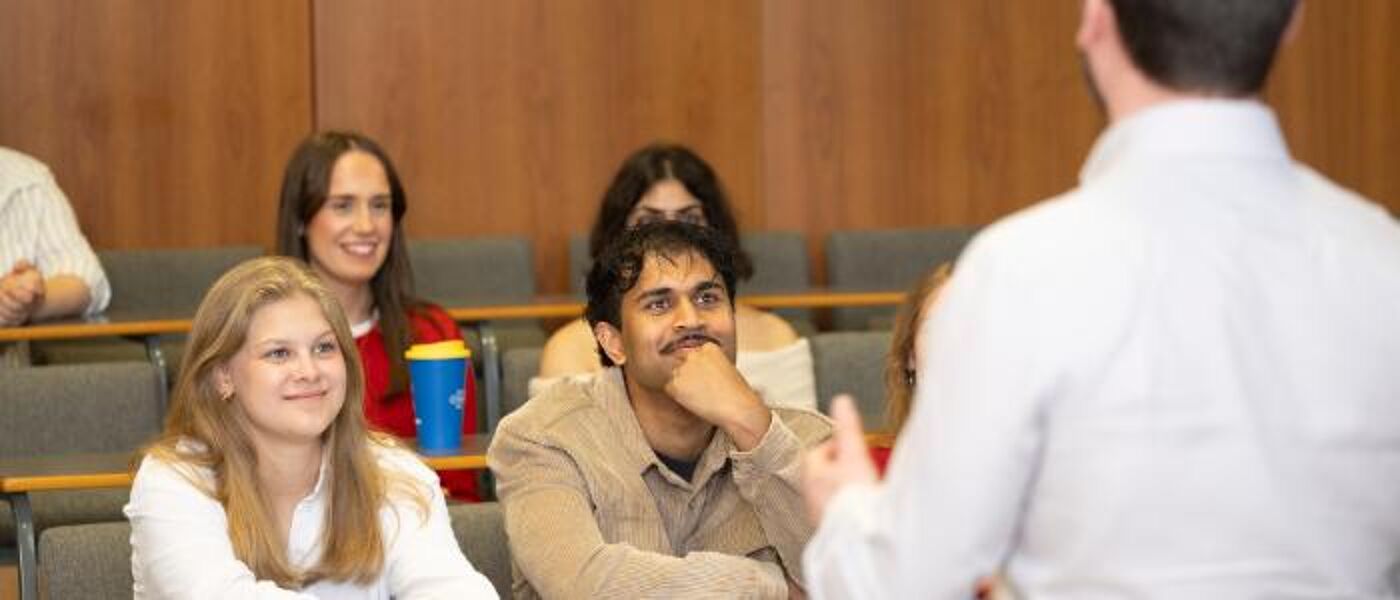 Students watching an employer presenting in front of them in the Wolfson Medical Building