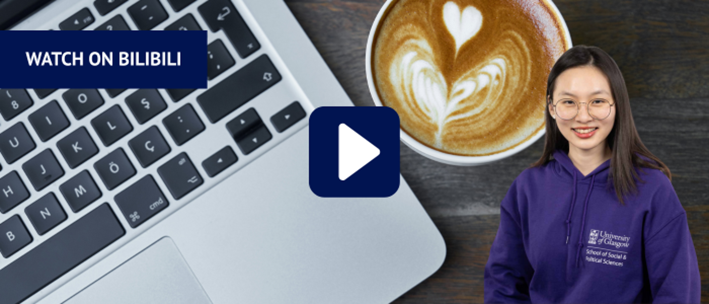 Laptop keyboard next to a cup of latte art coffee with headshot of woman