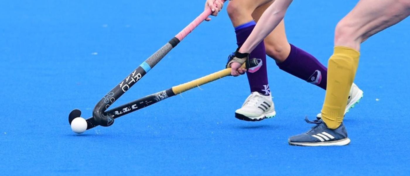 Hockey players competing to win the ball