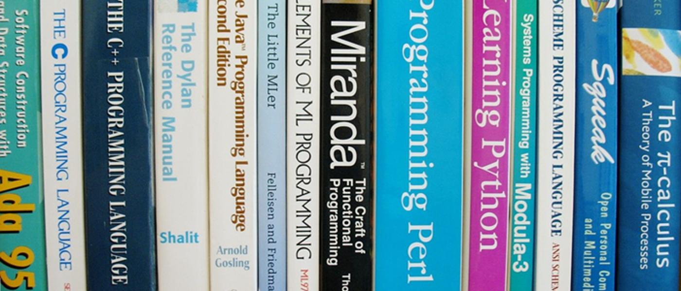 Book spines with titles related to programming