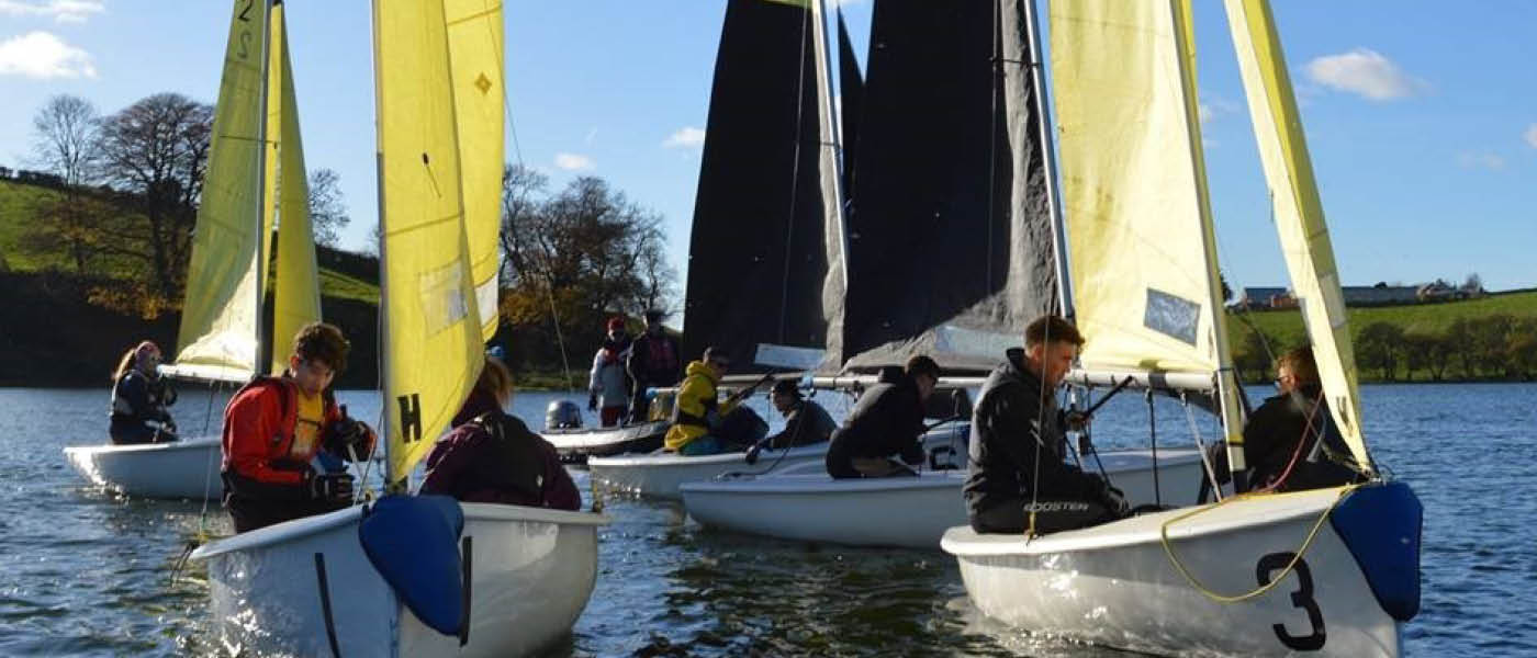 Group of students in sailing boats