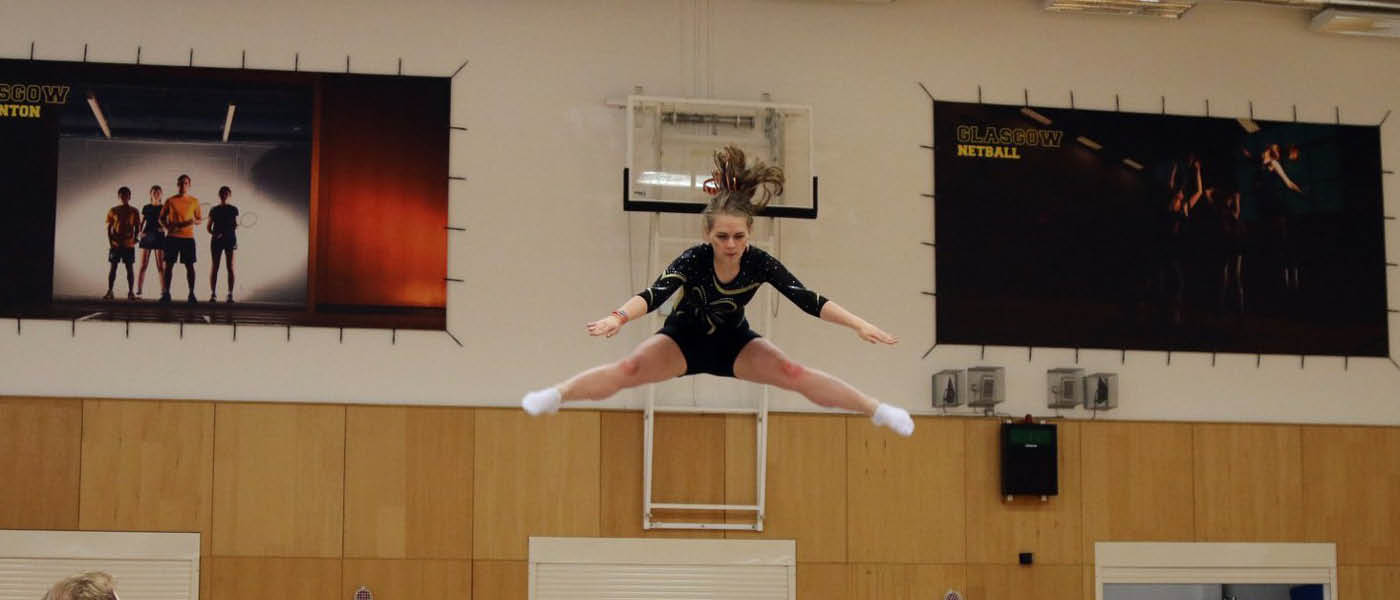 Student jumping on a trampoline