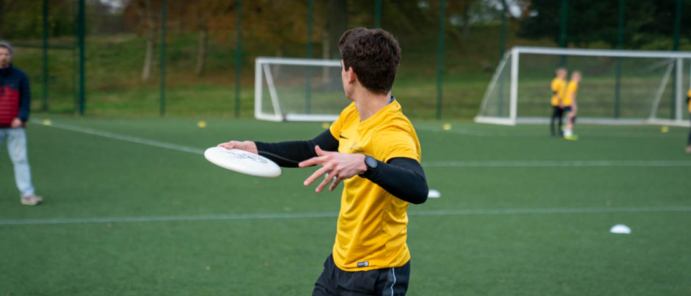 Student about to throw an ultimate frisbee