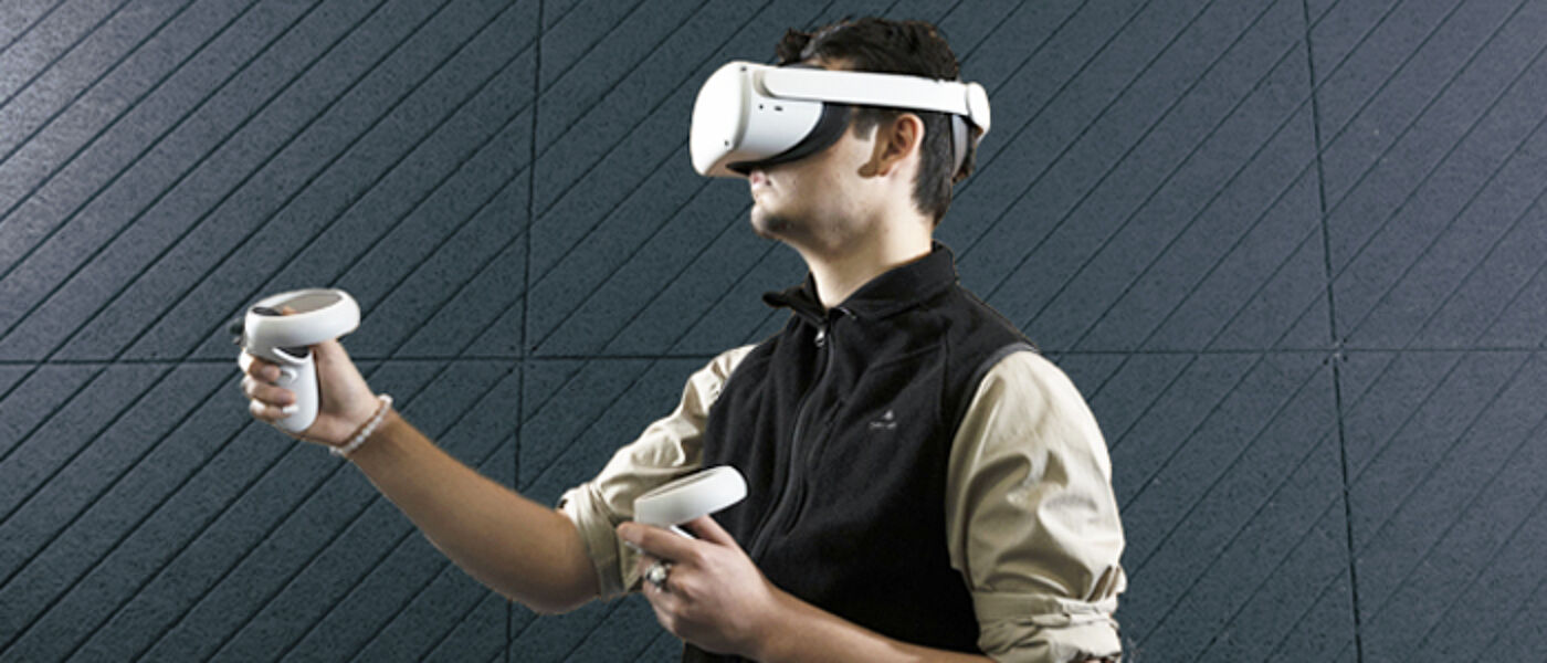 Student using in a VR suit with headset on