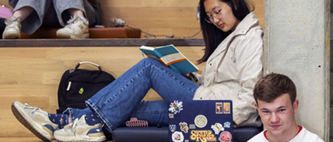 Student reading in the James McCune Smith building