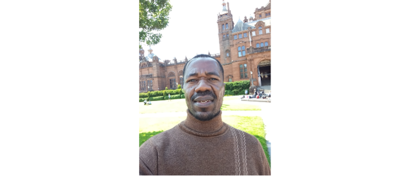 Junious Sichali, smiling at camera