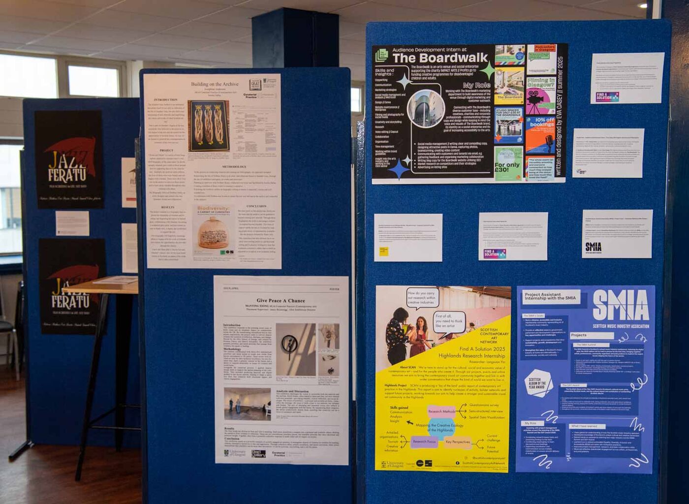 posterboards with various posters on them in QMU
