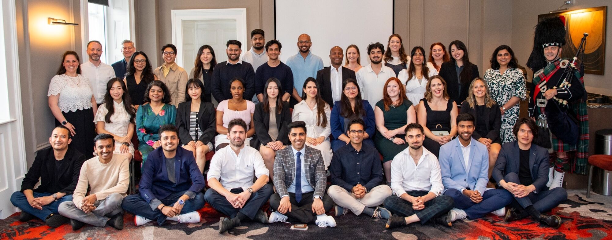 Group photo of ESSAM 2025 students sitting in a room at the Dumfries Campus, University of Glasgow