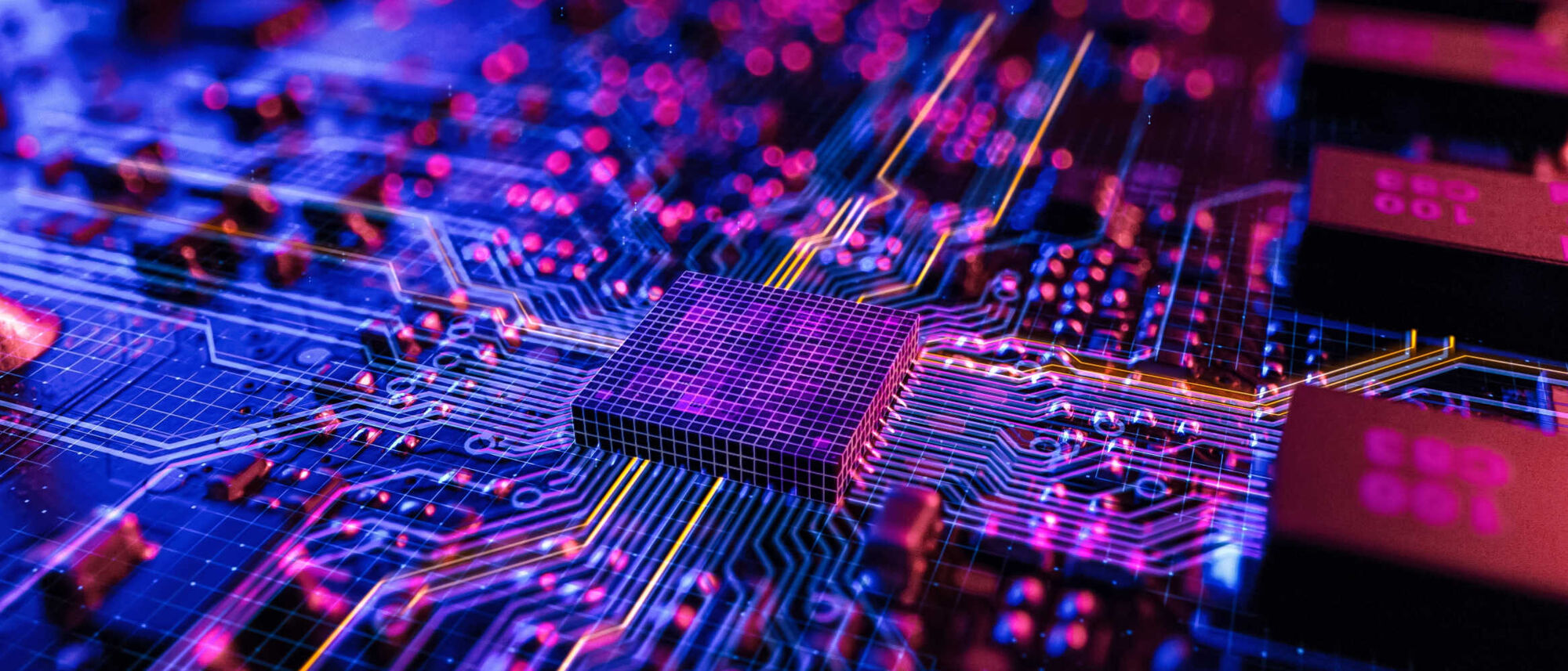 Extreme close-up of circuit boards, neon colouring