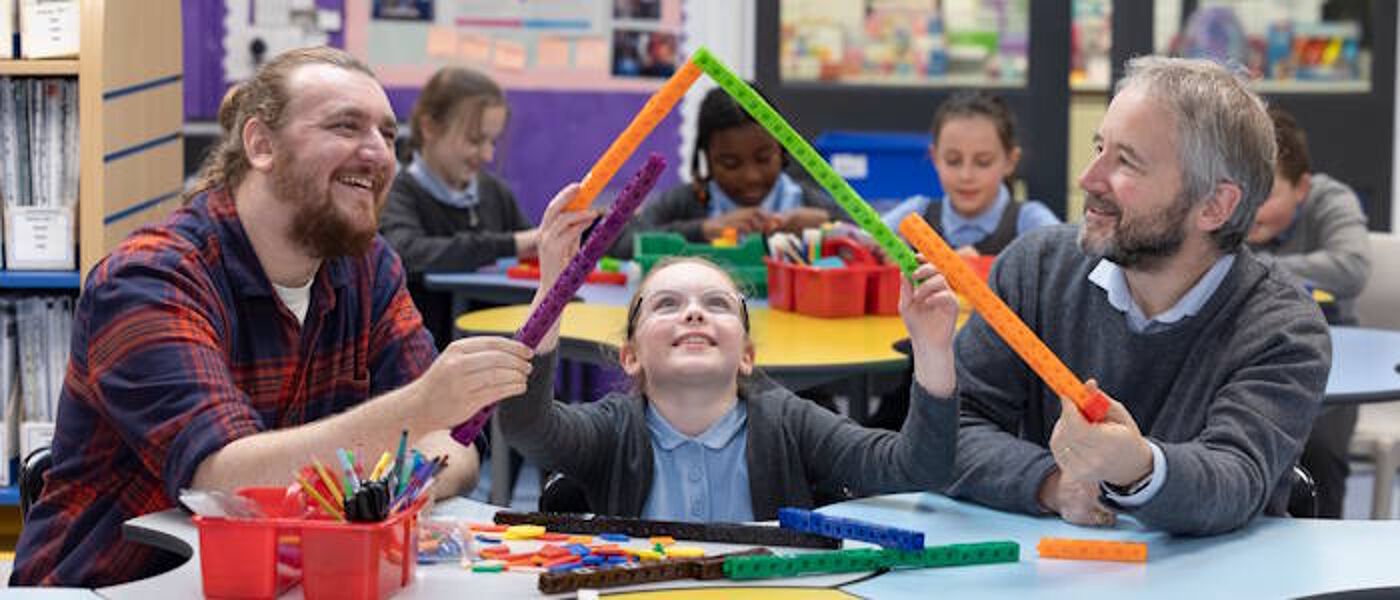 man and school pupil with triangle structure