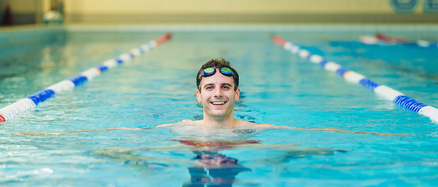 staff member smiling in UofG Sport swimming pool