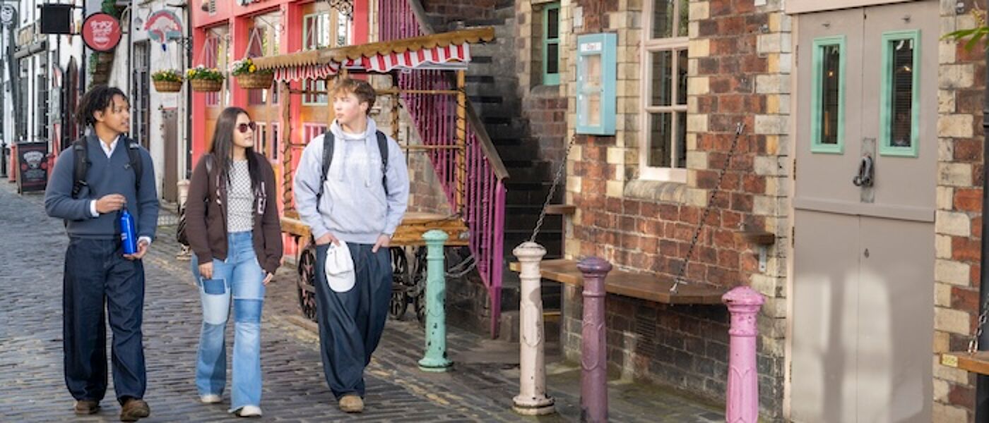 Three Students Walking Down Ashton Lane in Glasgow