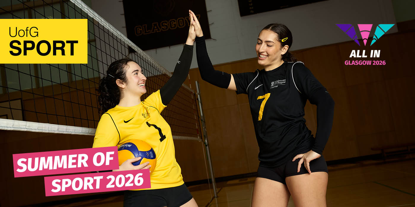 two students high-fiving in the UofG Sport gym