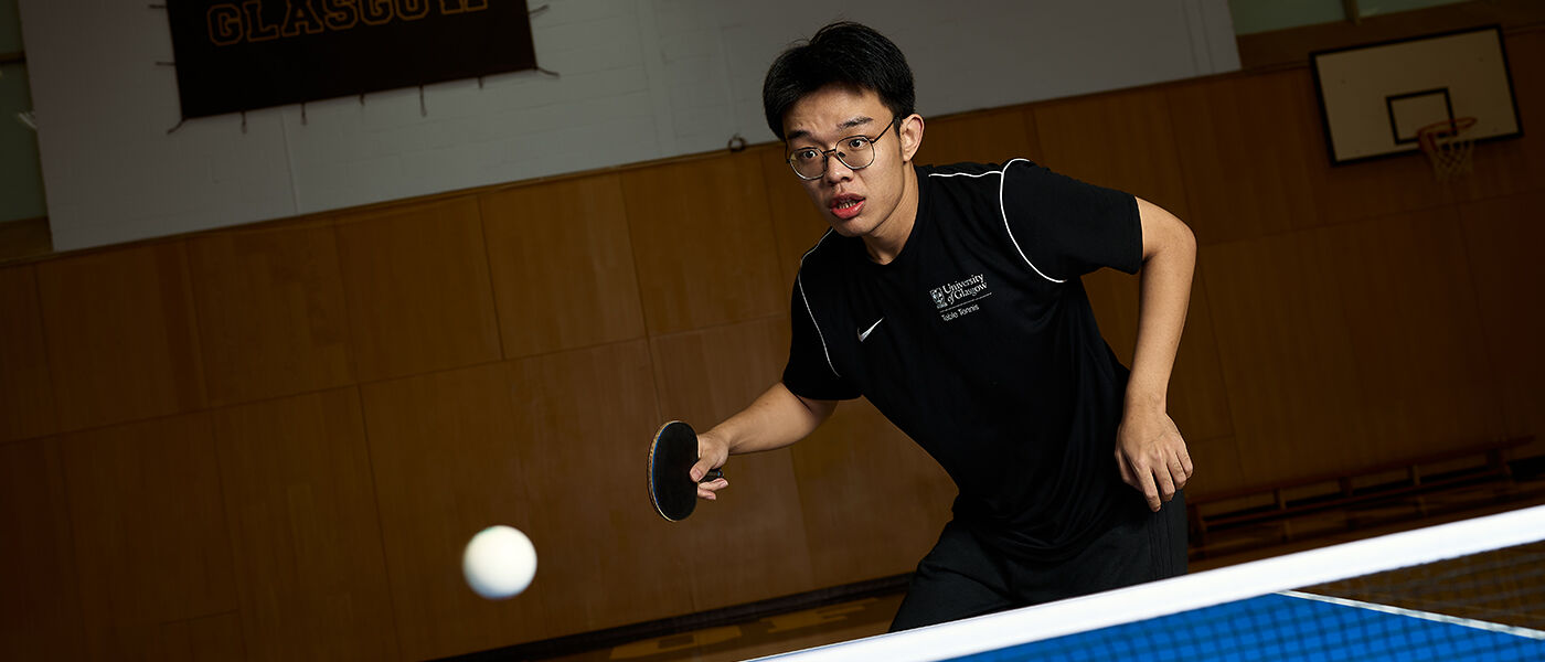 student playing table tennis