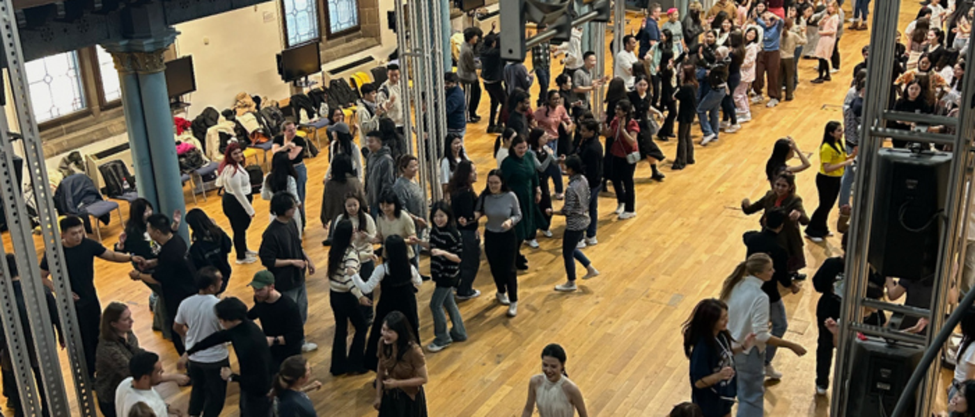 A group of students dancing in Bute Hall