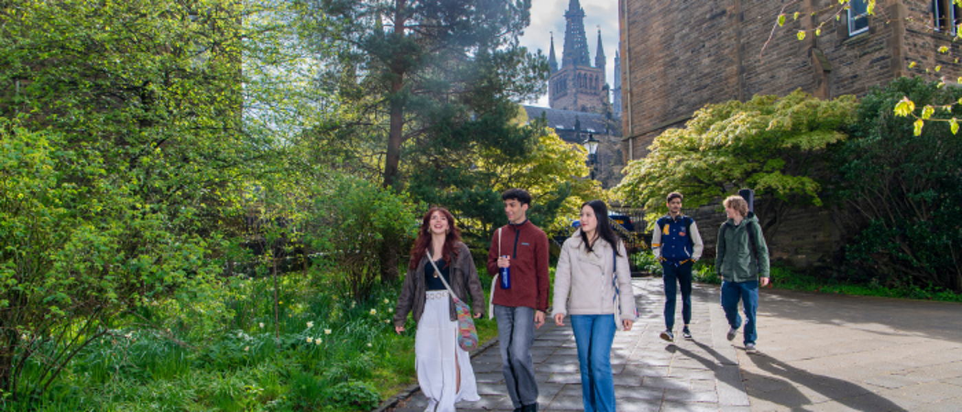 Three students walking together on the Gilmorehill campus
