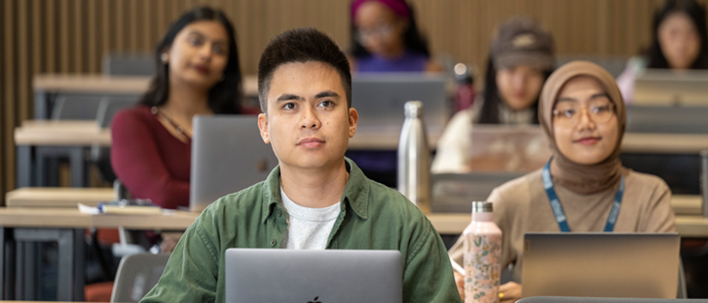 Students sitting in lecture-style room