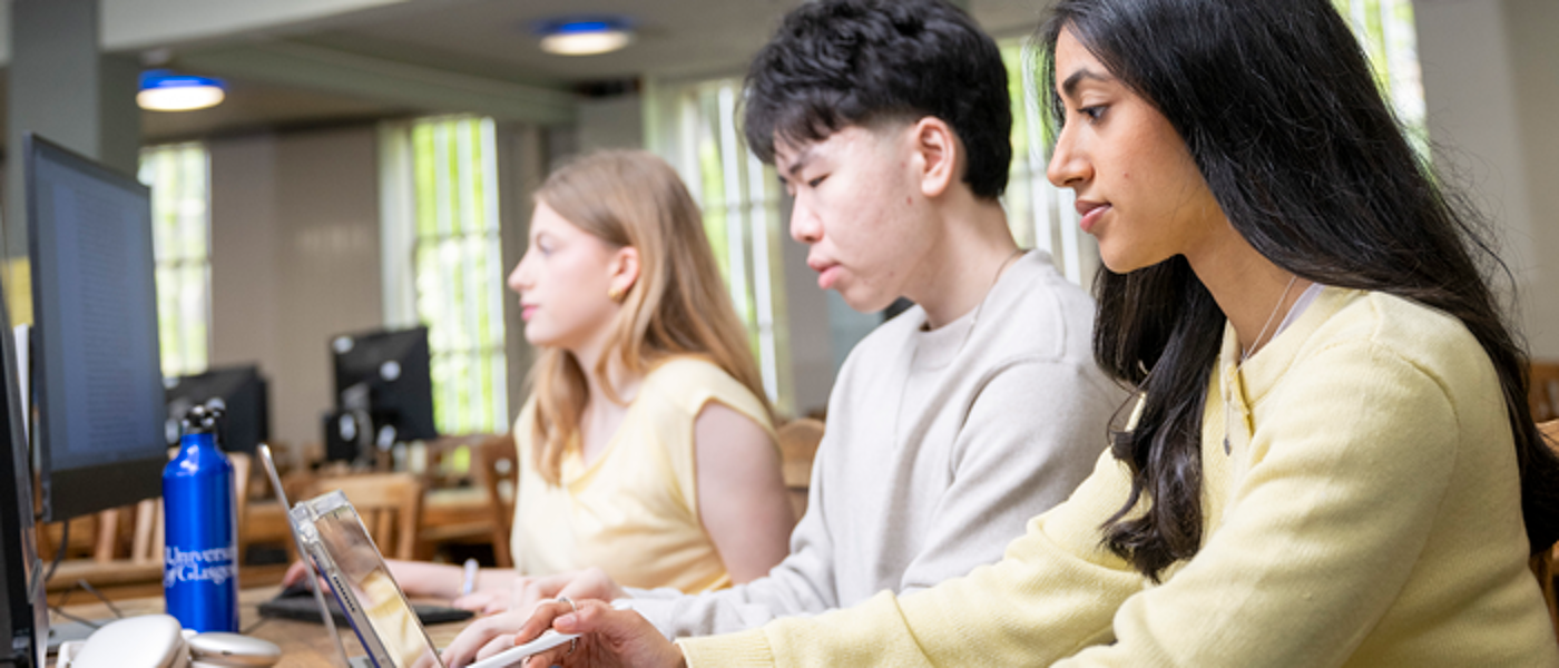 3 students studying in the McMillan Round Reading Room